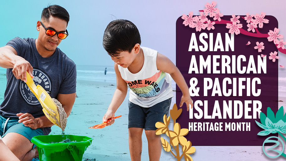 Man and child playing with sand on the beach beside a graphic that reads 'Asian American & Pacific Islander Heritage Month' with floral decorations
